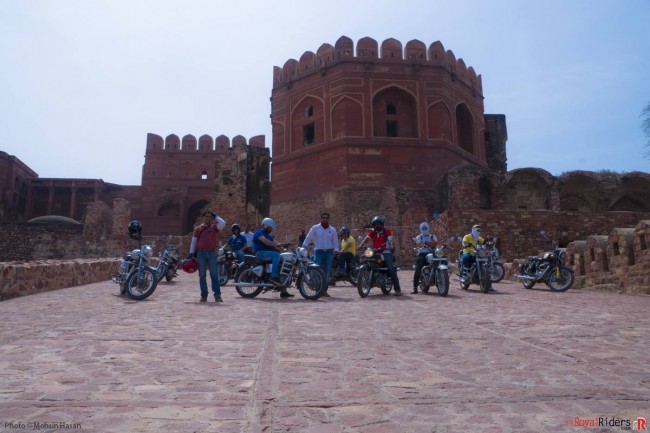 Fun all over - weRR at back of Fatehpur Sikri with their Royal Enfields.