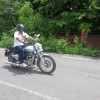 Riding their beloved Royal Enfield.