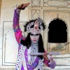 An actor depicting Lord Krishna at Deeg Braj Holi Festival